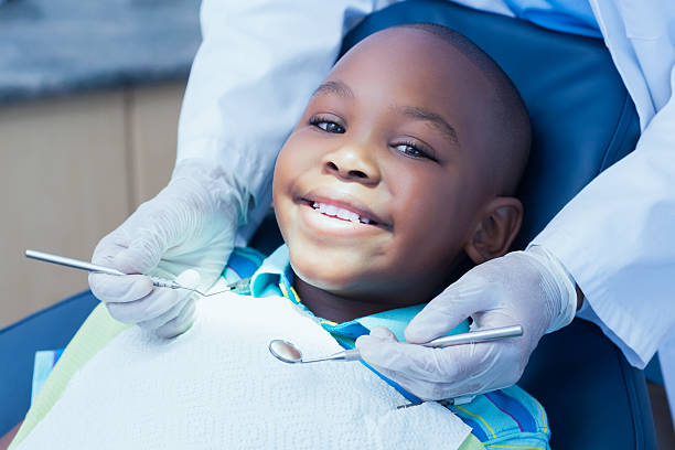 Young smiling child in a dental chair receiving care