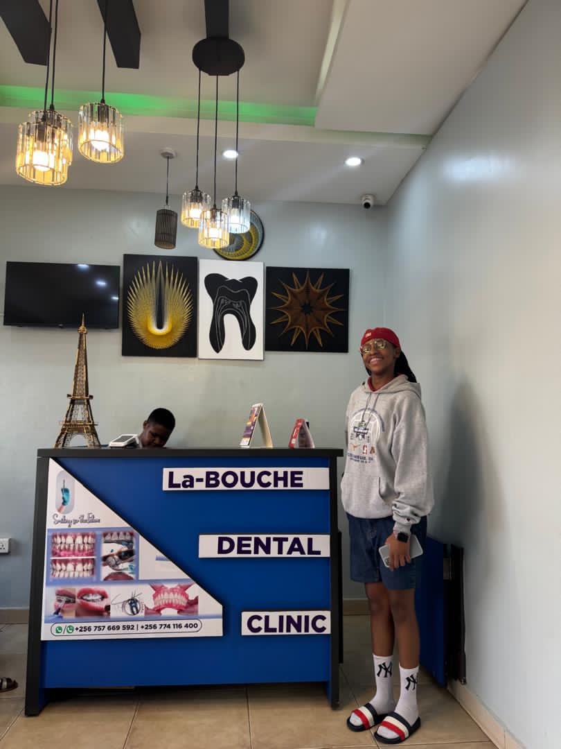 Happy patient at La Bouche Dental Clinic reception in Wandegeya Kampala