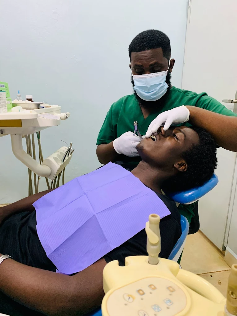 Dr Mzalendo La-Bouche treating a patient at La Bouche Dental Clinic